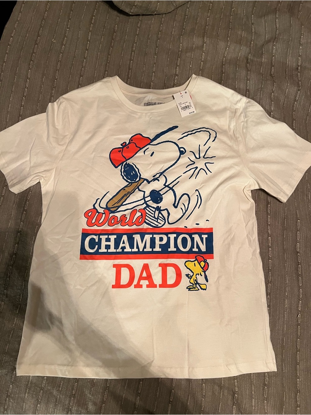 Peanuts Cream Tee with Snoopy 'World Champion Dad' Graphic